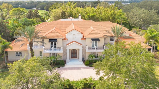 view of front of house featuring a balcony