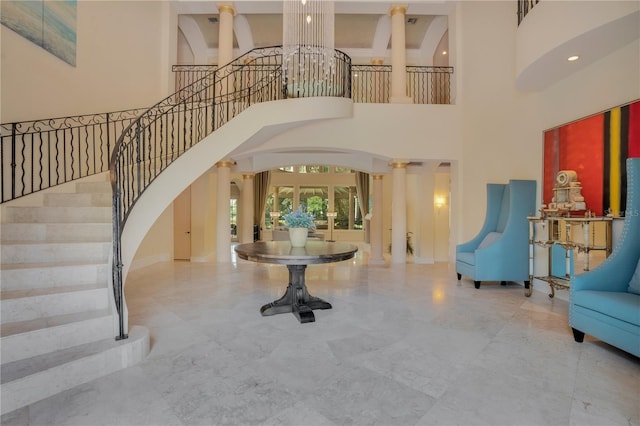 entryway featuring french doors and a high ceiling