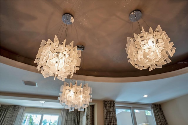 interior details featuring a notable chandelier