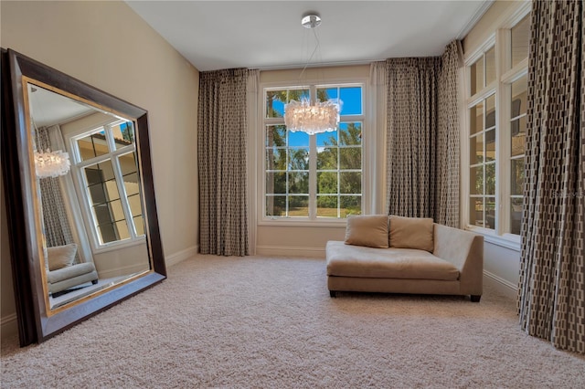 living area with carpet floors and an inviting chandelier