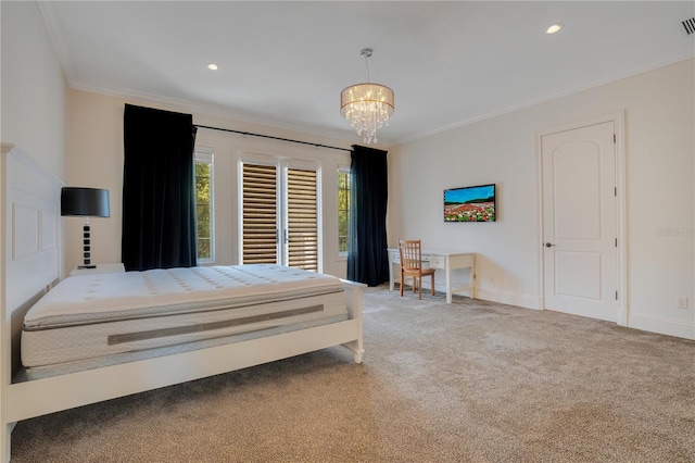 carpeted bedroom featuring a chandelier and crown molding