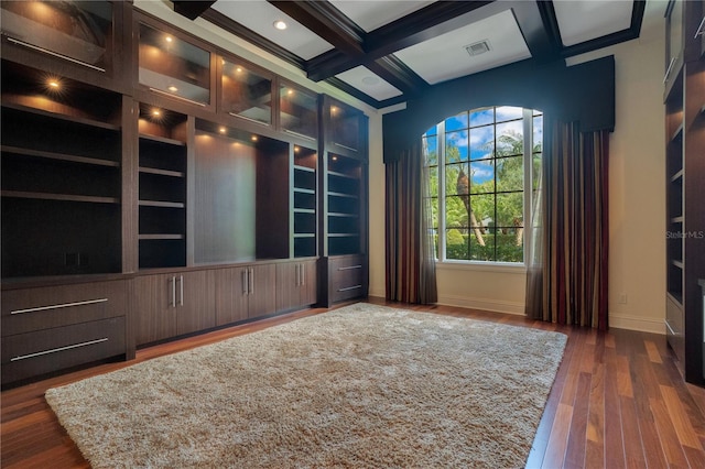 interior space featuring beamed ceiling, dark wood-type flooring, and coffered ceiling