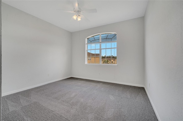 carpeted empty room featuring ceiling fan