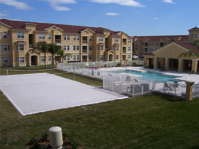 view of pool with a lawn, volleyball court, and a patio area