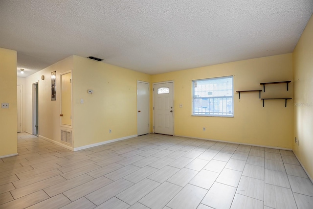 interior space with a textured ceiling