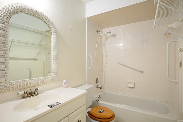 full bathroom with tiled shower / bath combo, vanity, and toilet