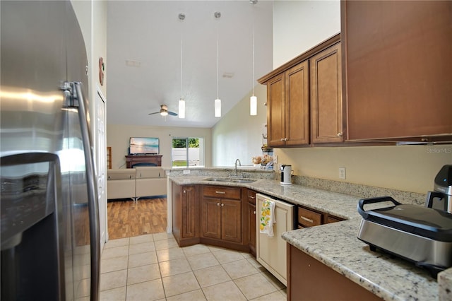 kitchen featuring sink, dishwasher, ceiling fan, lofted ceiling, and stainless steel refrigerator