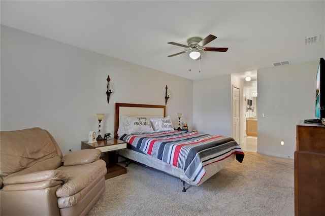 carpeted bedroom featuring ensuite bathroom and ceiling fan