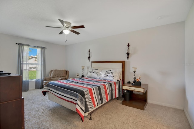 bedroom with light carpet and ceiling fan