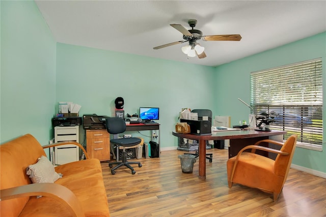 office space featuring light hardwood / wood-style floors and ceiling fan