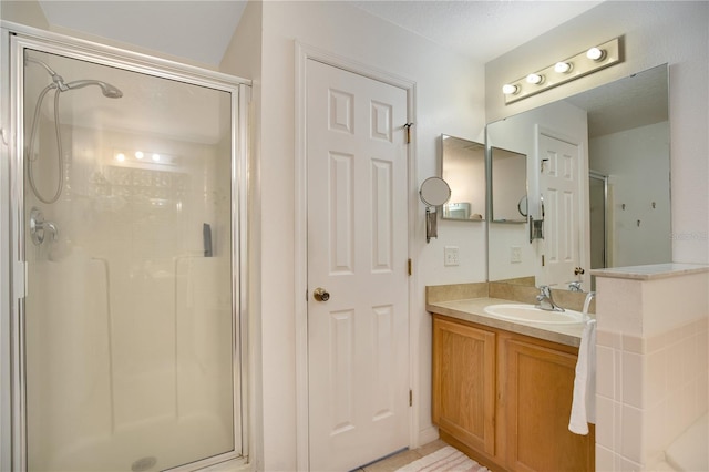 bathroom featuring vanity and walk in shower