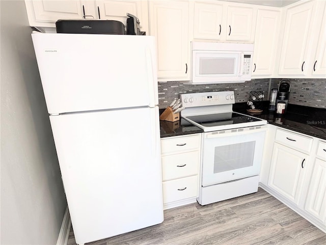 kitchen featuring white cabinets, decorative backsplash, and white appliances