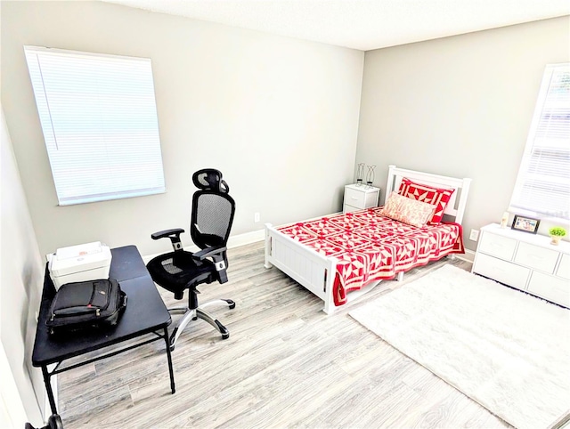 bedroom featuring light hardwood / wood-style floors