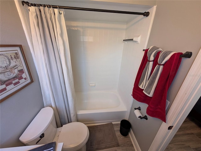 bathroom with shower / bath combination with curtain, toilet, and wood-type flooring