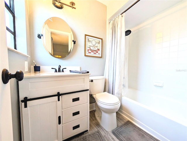 full bathroom with shower / bathtub combination with curtain, vanity, toilet, and wood-type flooring