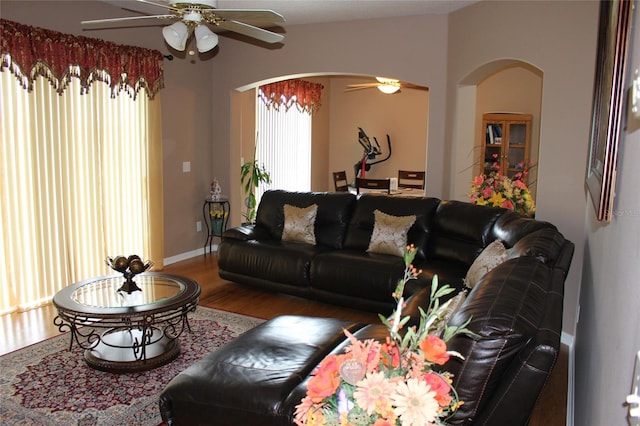 living room featuring hardwood / wood-style flooring and ceiling fan