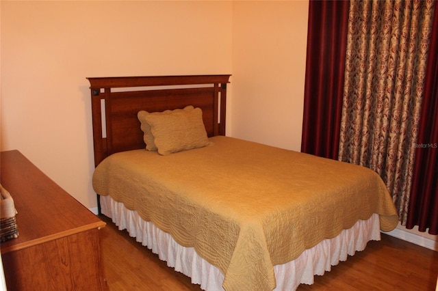 bedroom featuring hardwood / wood-style floors