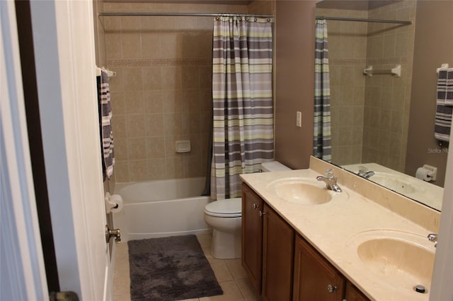 full bathroom featuring shower / bath combination with curtain, tile patterned flooring, vanity, and toilet