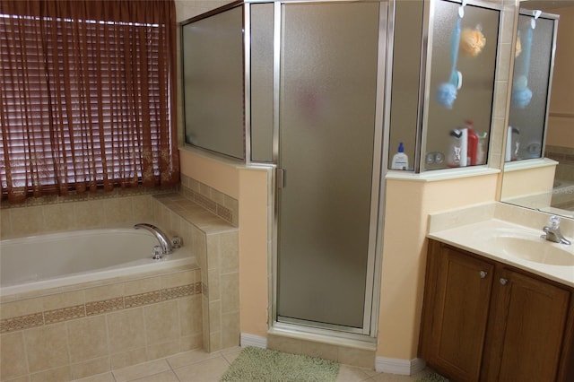 bathroom with vanity, separate shower and tub, and tile patterned flooring