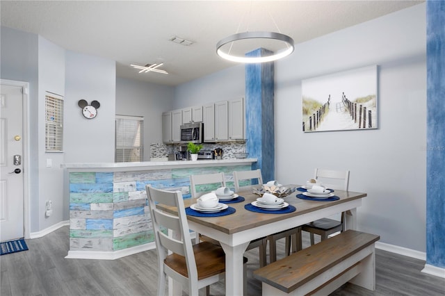 3052 Secret Lake Dr, Kissimmee, FL 34747 - dining area with wood finished floors