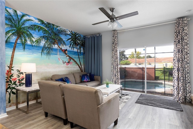 3052 Secret Lake Dr, Kissimmee, FL 34747 - living area featuring ceiling fan and wood finished floors