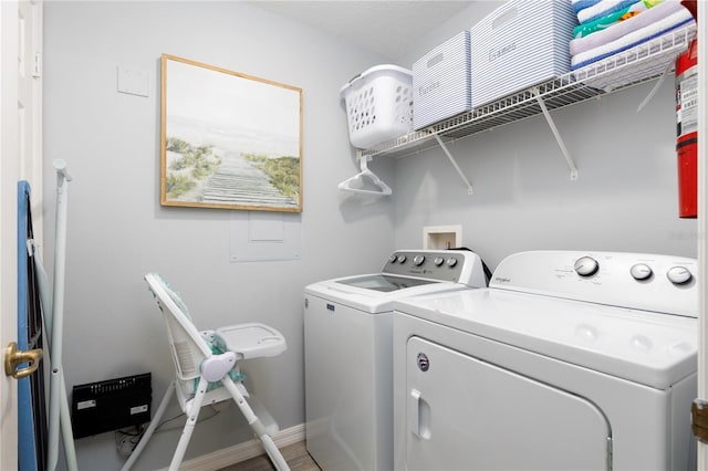 3052 Secret Lake Dr, Kissimmee, FL 34747 - washroom featuring independent washer and dryer and baseboards