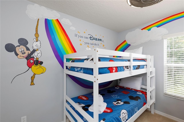 carpeted bedroom with a textured ceiling