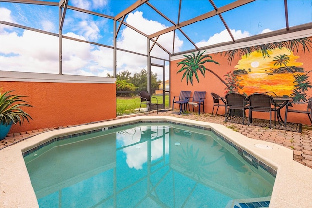 view of pool with a lanai and a patio area