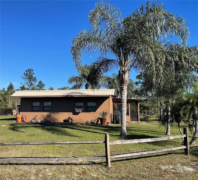 view of front of property with a front lawn