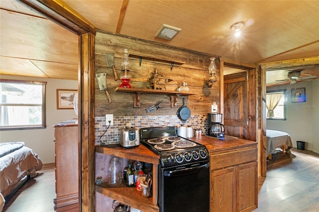 kitchen with backsplash, ceiling fan, wood-type flooring, wooden ceiling, and black range with electric stovetop