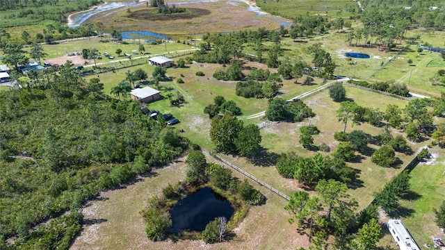 drone / aerial view featuring a rural view and a water view