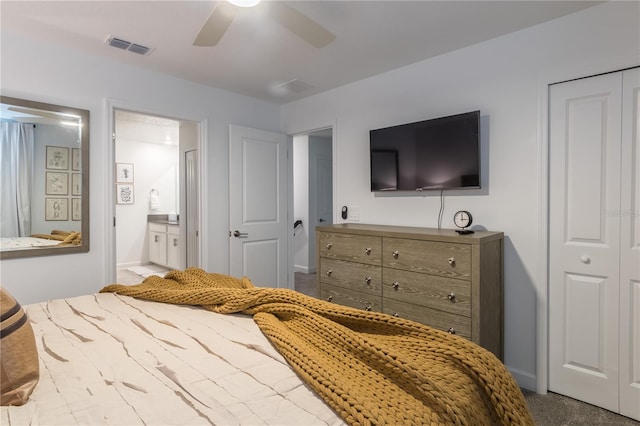 bedroom with a ceiling fan, visible vents, and connected bathroom