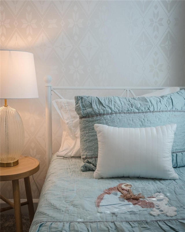 bedroom with wallpapered walls
