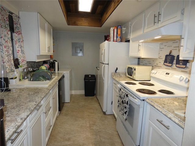 kitchen featuring white cabinets, sink, white appliances, light stone countertops, and decorative backsplash