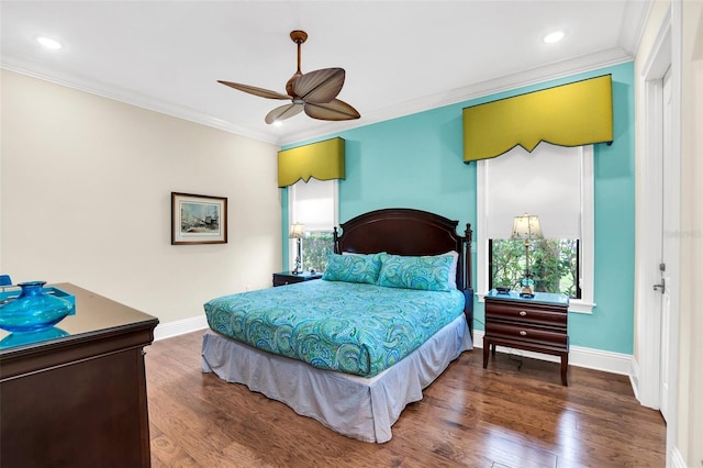 bedroom featuring ornamental molding, wood-type flooring, multiple windows, and ceiling fan