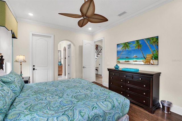 bedroom featuring crown molding, dark wood-type flooring, and ceiling fan