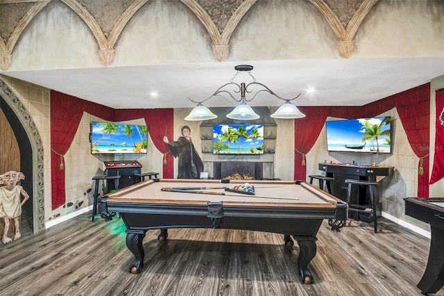 game room with a fireplace, billiards, and hardwood / wood-style flooring