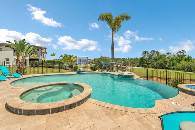 view of pool featuring a patio and an in ground hot tub