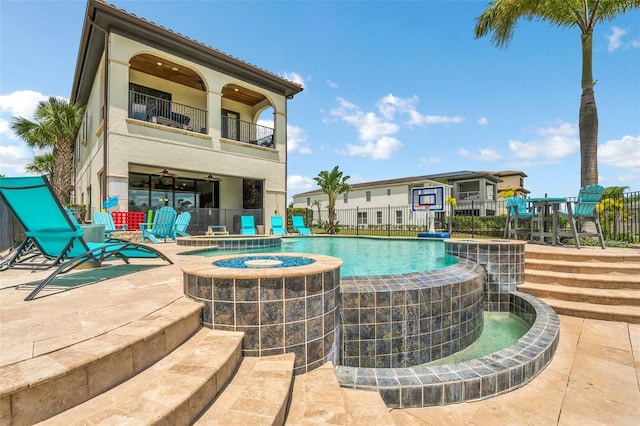 view of swimming pool with a patio and a jacuzzi