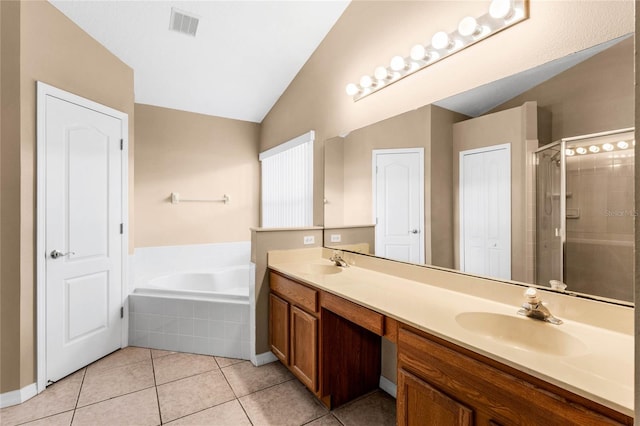 bathroom featuring vanity, shower with separate bathtub, lofted ceiling, and tile patterned flooring