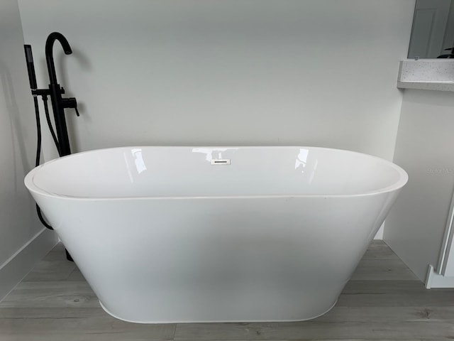 6895 SW 130th Ln, Ocala, FL 34473 - bathroom view of a freestanding tub and baseboards