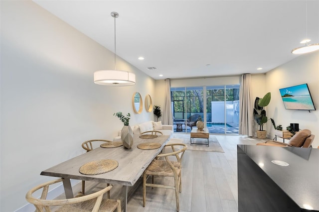 dining room featuring light hardwood / wood-style floors