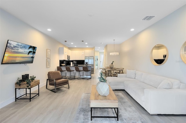 living room featuring light wood-type flooring