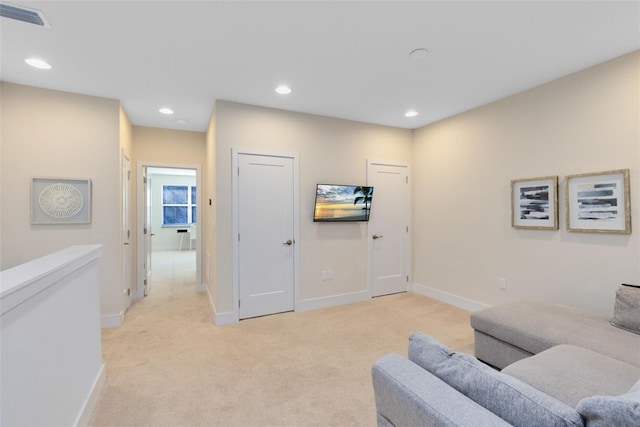 sitting room with light colored carpet