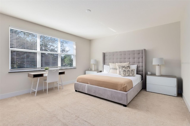 bedroom featuring light carpet