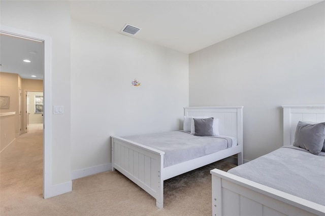 bedroom with light colored carpet