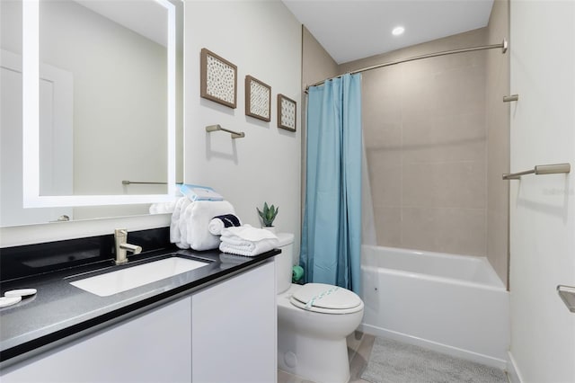 full bathroom featuring vanity, shower / tub combo, and toilet