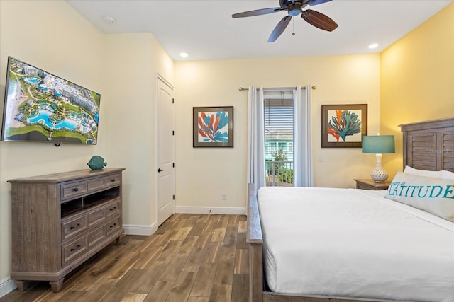 bedroom featuring ceiling fan and dark wood-type flooring