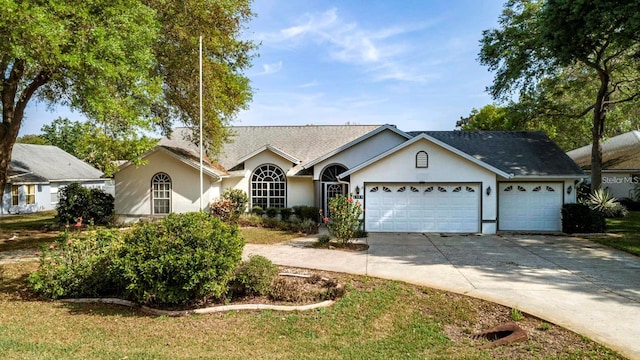 ranch-style house featuring a garage