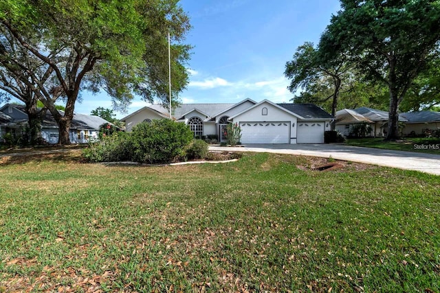 single story home featuring a front lawn and a garage